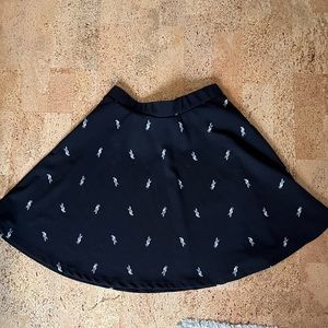 Black Aline skirt with white parrots